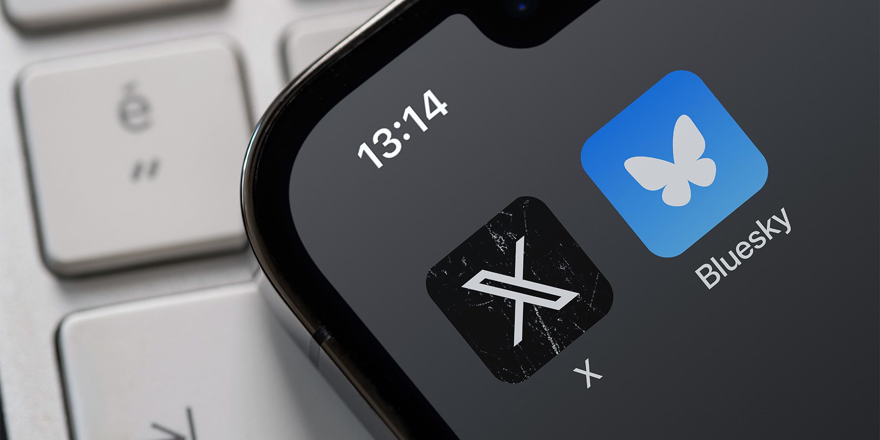 X (Twitter) and Bluesky Social apps displayed on an iPhone screen